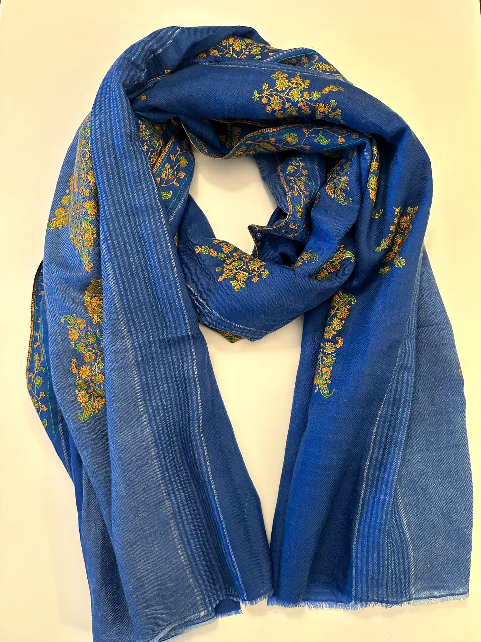 Cornflower blue stole with gold floral clusters and fine stripes.