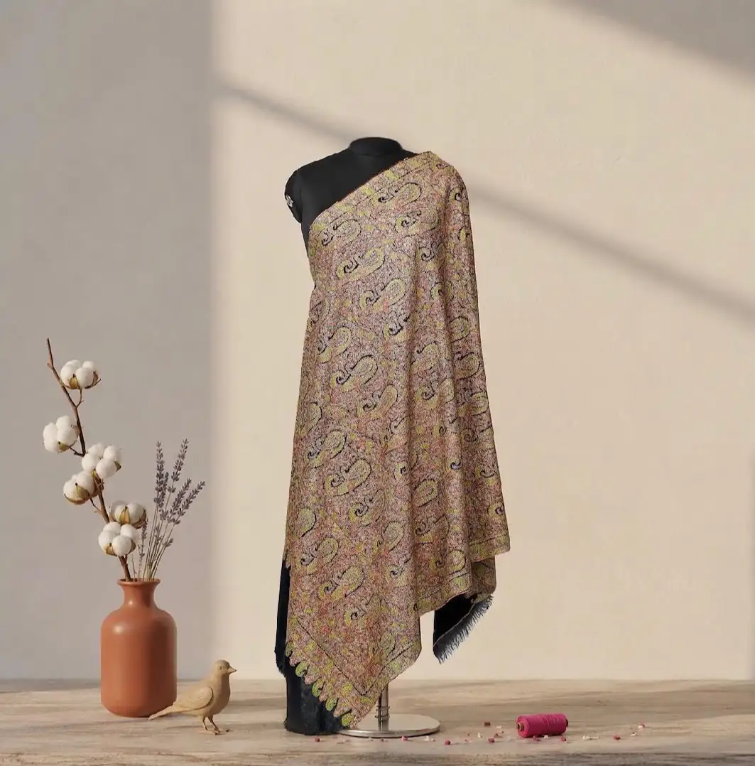 Stole covered edge to edge in olive, coral and black paisley, draped on a dress form beside a vase of cotton and lavender.