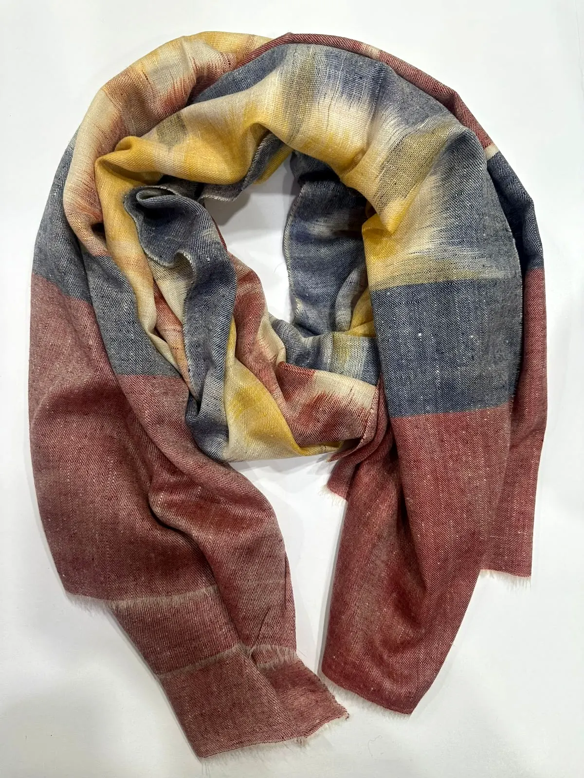 Stole with blurred saffron and grey ikat stripes and brick red ends.
